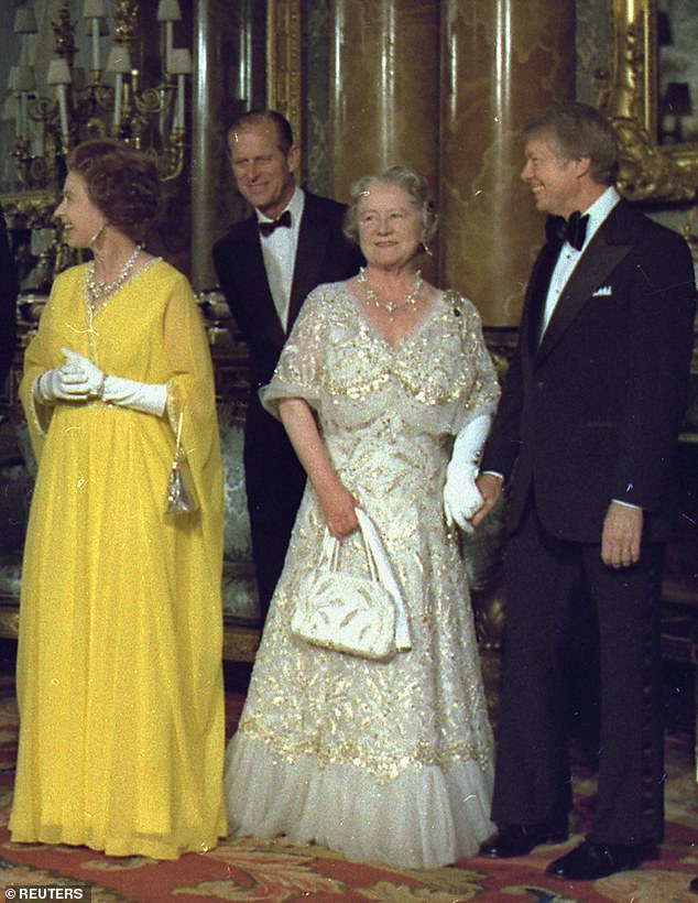 President Carter, right, can be seen holding the gloved left hand of the Queen Mother. Queen Elizabeth II is seen in a yellow gown, far left