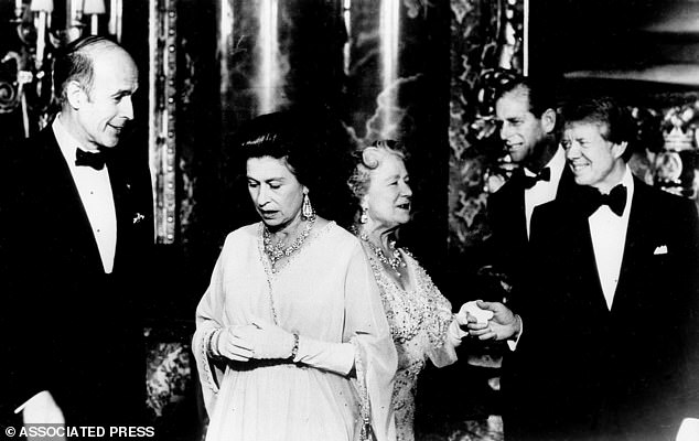 French President Giscard d'Estaing, left, chats with Queen Elizabeth II, and President Jimmy Carter escorts the Queen Mother to pose for photographers prior to the State Dinner, May 7, 1977, at Buckingham Palace. Behind Carter is Prince Philip