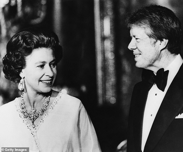 Carter is pictured with the Queen. He and other NATO heads of state attended a dinner at the palace on May 10, 1977