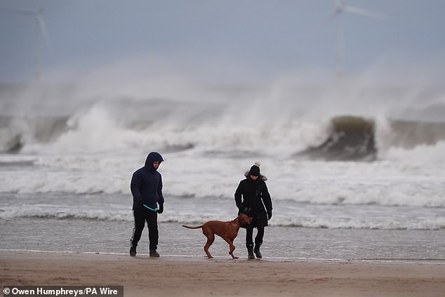 Sand is whipped up by the wind on Tynemouth Longsands beach in North Tyneside today