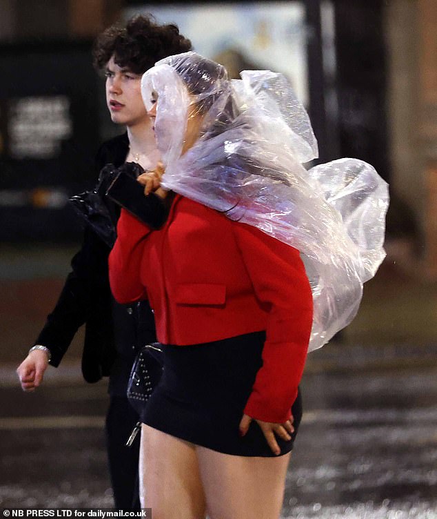 LEEDS: Some revellers in Leeds braced the rain by wearing plastic covers over their outfits