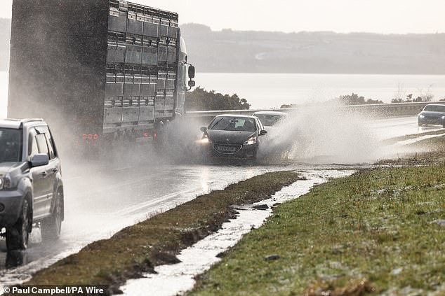 Vehicles driven on the A9 in Inverness today as snow, rain and wind warnings are in force