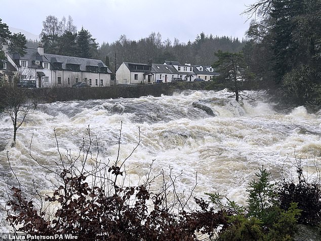 White water at the Falls of Dochart in Killin, Stirlingshire, today as stormy weather hits Scotland