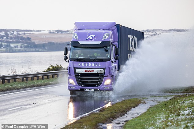 Vehicles driven on the A9 in Inverness today as snow, rain and wind warnings are in force