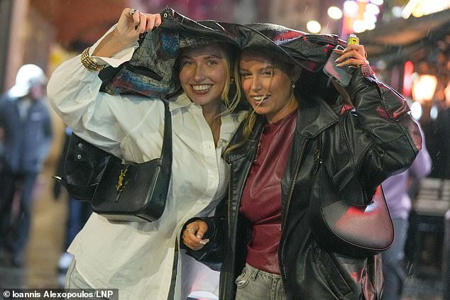 LIVERPOOL: Revellers make the most New Year's Eve in Liverpool city centre despite the rain