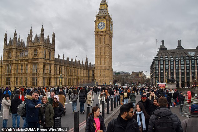 Crowds gather on the closed Westminster Bridge ahead of tonight's New Year fireworks show