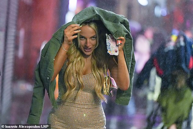 LIVERPOOL: Revellers brave heavy rain as they make the most New Year's Eve in Liverpool city centre