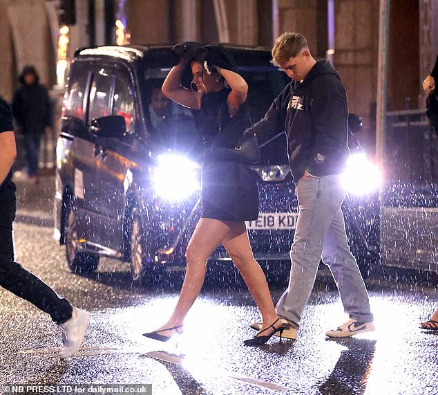 LEEDS: Revellers brave the pouring rain as they are heading out for New Year's celebrations in Leeds