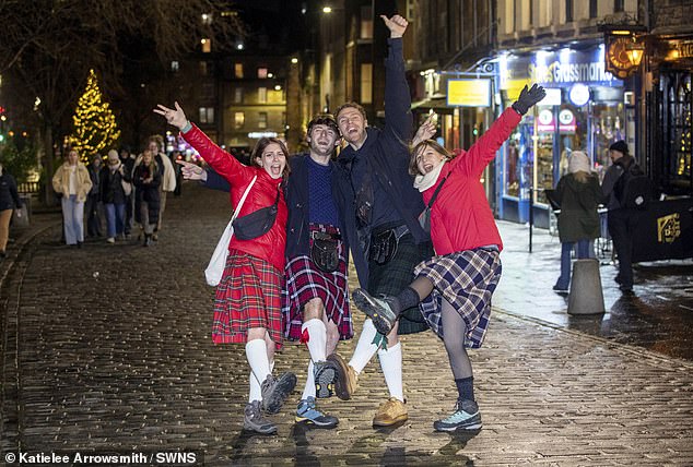 EDINBURGH: Friends from France who flew to Scotland for New Years Eve celebrations enjoy Hogmanay Edinburgh in The Grassmarket after the official street party was cancelled due to weather on December 31, 2024