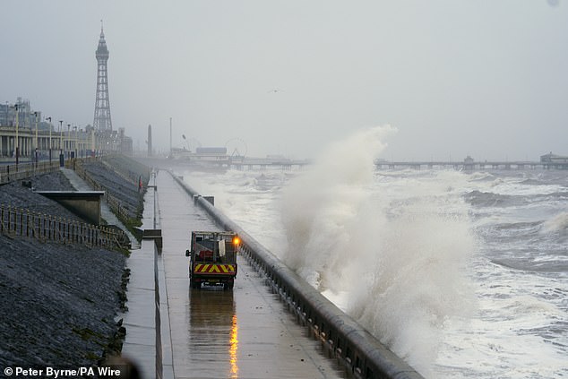 Waves hit Blackpool seafront in Lancashire today as snow, rain and wind warnings are in force