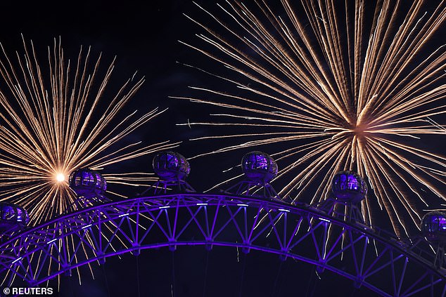 Fireworks explode over the London Eye to mark the New Year's celebrations