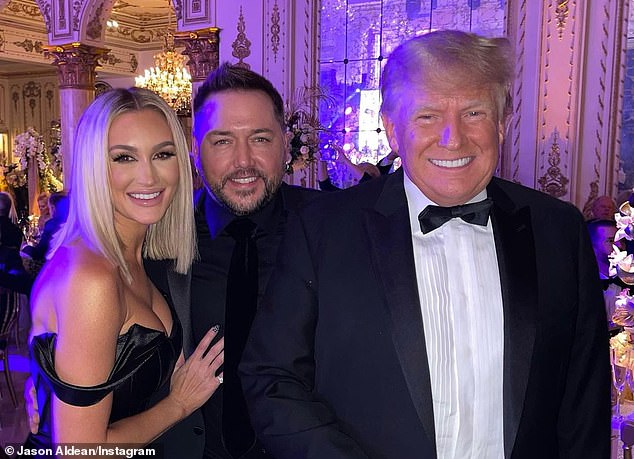 Country singer Jason Aldean (center) poses for a picture with former President Donald Trump (right) and his wife Brittany (left) on New Year's Eve at Mar-a-Lago in 2021. In 2022 Trump would announce his third run for the presidency