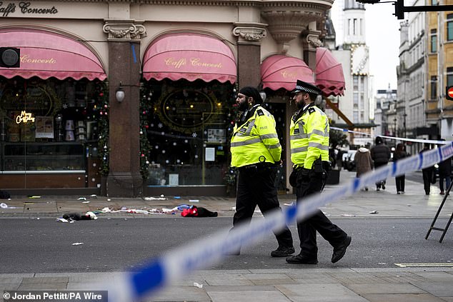 Police officers at the scene on Christmas Day on Shaftesbury Avenue in London's West End