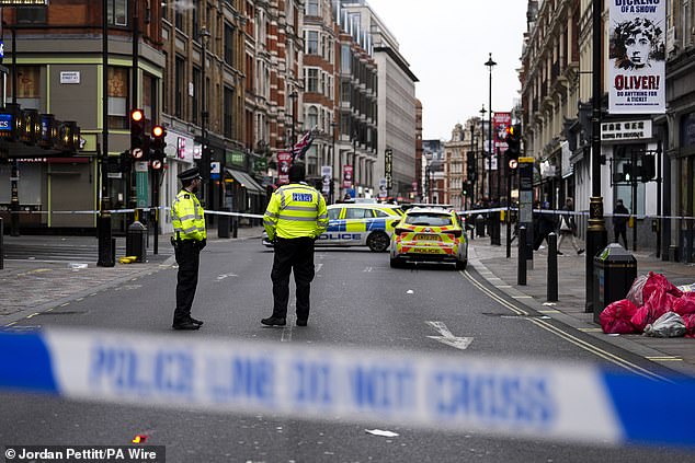 Police officers at the scene on Christmas Day on Shaftesbury Avenue in London's West End