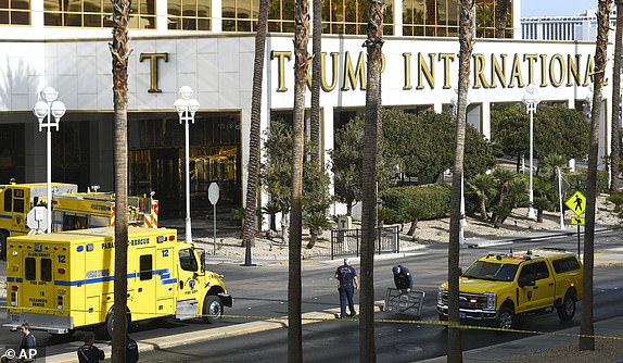 Clark County Fire Department crews work outside Trump International Hotel in Las Vegas after the fire and explosion of a Tesla Cybertruck in the valet area, on Wednesday, Jan. 1, 2025. (Sam Morris/Las Vegas Review-Journal via AP)