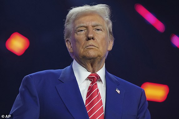 President-elect Donald Trump speaks at AmericaFest, Sunday, Dec. 22, 2024, in Phoenix. (AP Photo/Rick Scuteri)