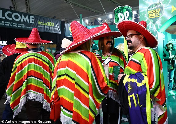 Darts - 2025 PDC World Darts Championship - Alexandra Palace, London, Britain - January 2, 2025 Fans in fancy dress costumes before the start of play Action Images via Reuters/Andrew Boyers