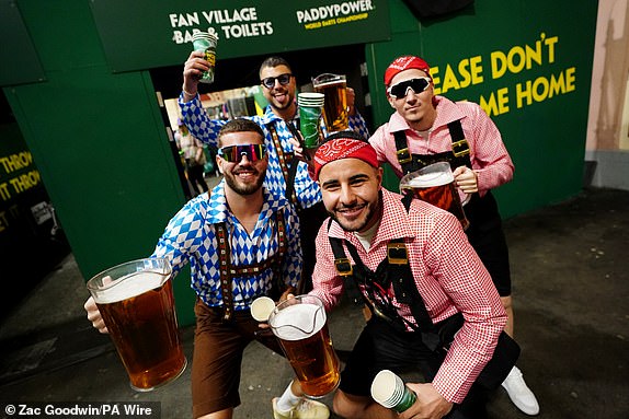 Darts fans in fancy dress during day fifteen of the Paddy Power World Darts Championship at Alexandra Palace, London. Picture date: Thursday January 2, 2025. PA Photo. See PA story DARTS World. Photo credit should read: Zac Goodwin/PA Wire.RESTRICTIONS: Use subject to restrictions. Editorial use only, no commercial use without prior consent from rights holder.