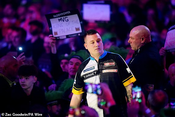 Chris Dobey walks out to play their semi-final match against Michael van Gerwen (not pictured) during day fifteen of the Paddy Power World Darts Championship at Alexandra Palace, London. Picture date: Thursday January 2, 2025. PA Photo. See PA story DARTS World. Photo credit should read: Zac Goodwin/PA Wire.RESTRICTIONS: Use subject to restrictions. Editorial use only, no commercial use without prior consent from rights holder.