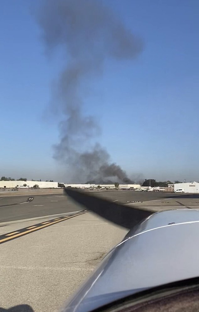 Eleven people were injured when a small plane collided into the rooftop of a commercial building in Southern California on Thursday, police said. This photo was taken from nearby Fullerton airport