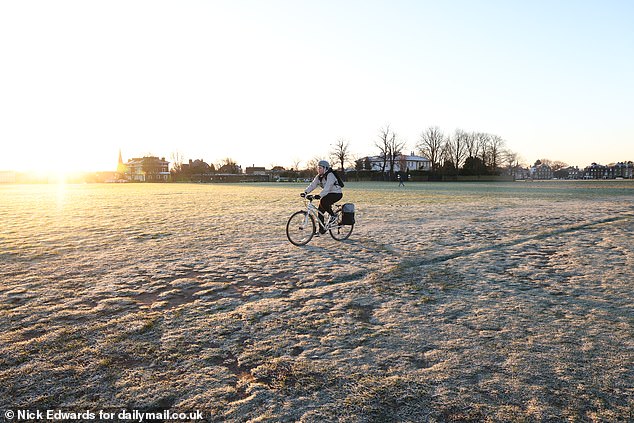 A freezing start as a cyclist makes their way through Blackheath in South East London