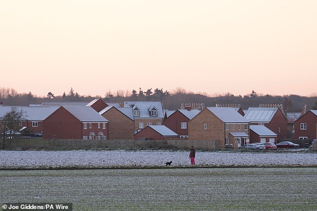 Frost covers houses and the ground at Martham in Norfolk yesterday amid the sub-zero weather