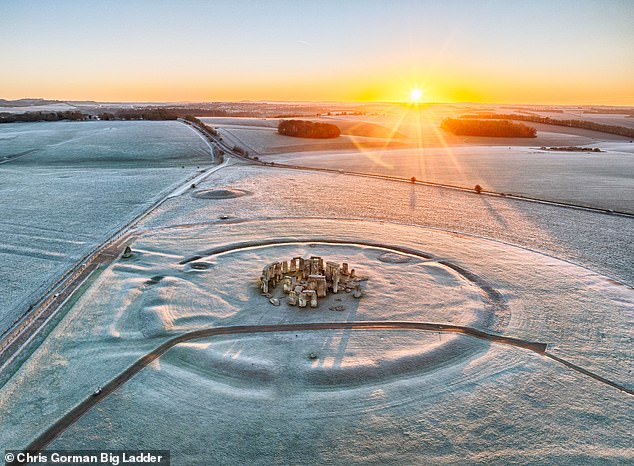 A hard frost turns Stonehenge white at dawn in Wiltshire on Friday morning amid sub-zero weather