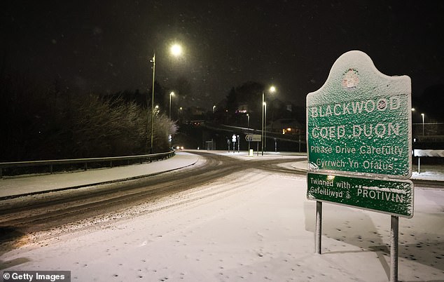 An image of a snow covered road sign on January 04, 2025 in Blackwood, Wales