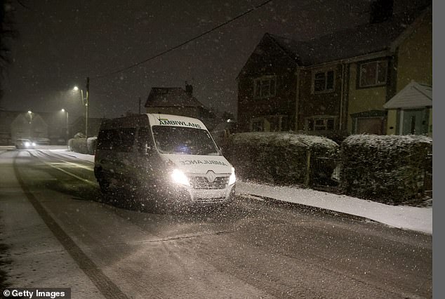 An ambulance drives through the freshly laid snow on January 04, 2025 in Blackwood, Wales