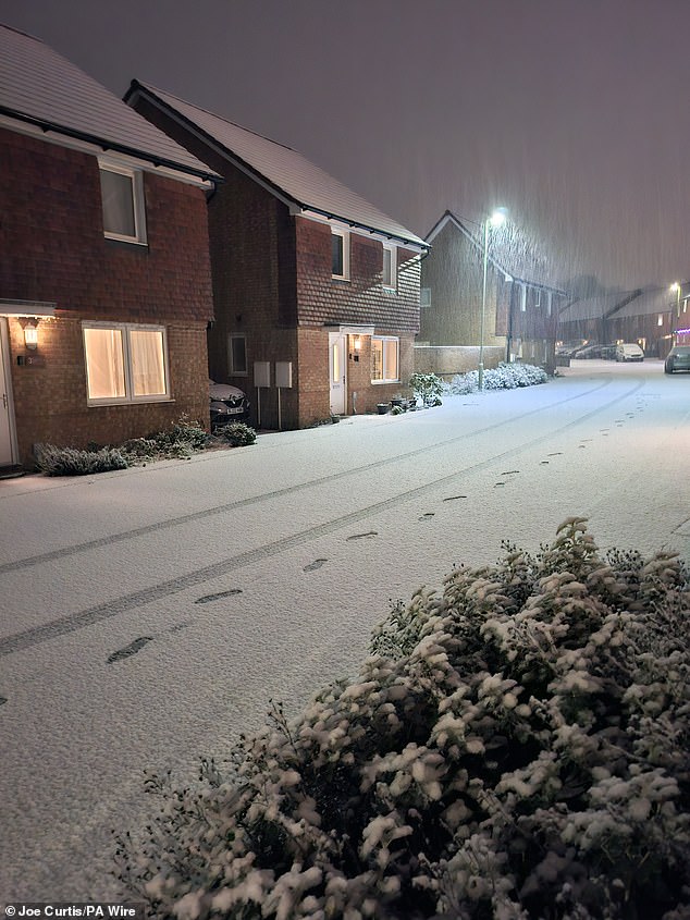 Snow falling in Basingstoke. Large parts of the country will face disruption from heavy snow