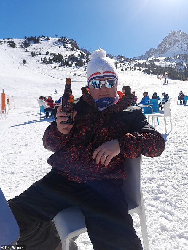 Phil Wilson, 54, from Sheffield, regrets having a Covid booster jab to ensure he was able to go on a family holiday skiing trip to Andorra - he is seen here enjoying a previous break