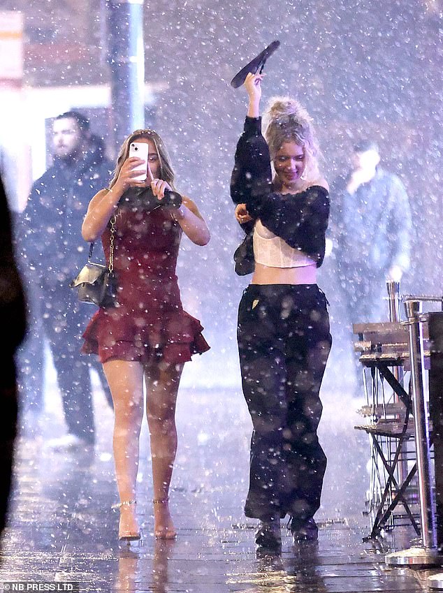 Snow begins to fall in Leeds as party goers brave the arctic conditions