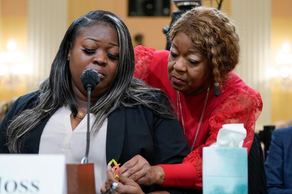 Shaye Moss is comforted by her mother, Ruby Freeman, at a House select committee hearing. The two Georgia election workers were repeatedly defamed by Giuliani (AP)