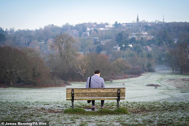 LONDON: A person makes the most of the wintry landscape views as they sit on a bench in Hampstead Heath on Friday