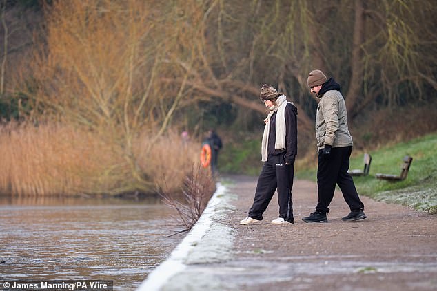 LONDON: People watch on in awe as a lake in Hampstead Heath is frozen over on Friday