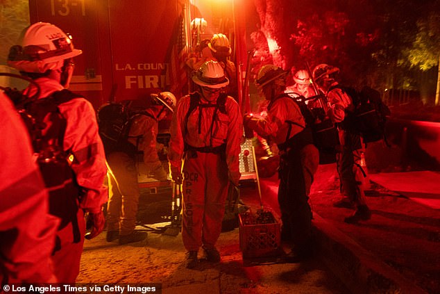 Multiple people have also made response videos slamming Leo's rhetoric as 'dangerous' and filled with 'fearmongering' about homeless people. Pictured, firefighters in LA this month