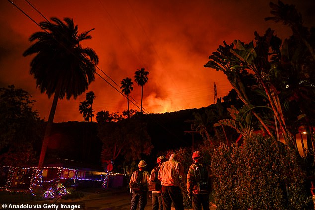 A view of wild fire as firefighting planes and helicopters drop water over flames in Mandeville Canyon during 'Palisades Fire' in Los Angeles, California, United States on January 10, 2025