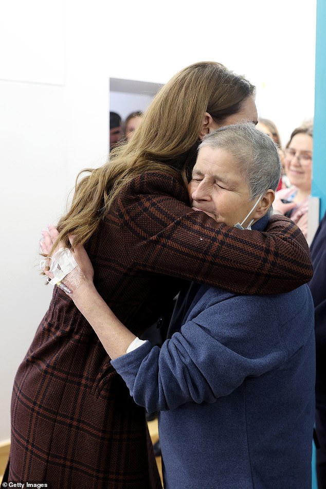 The Princess of Wales hugs patient Rebecca Mendelhson at the Royal Marsden Hospital today