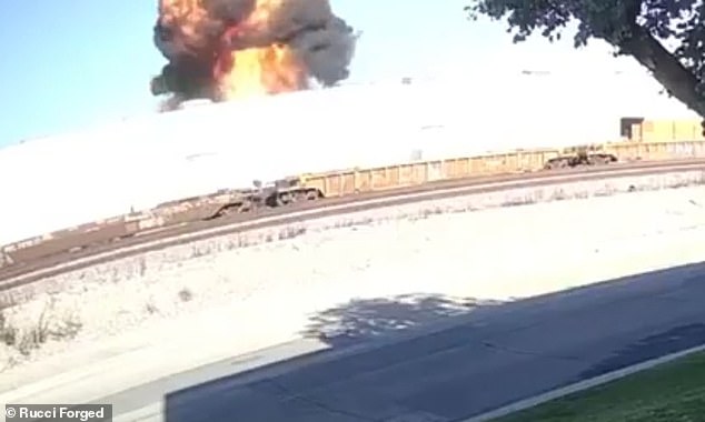 An enormous fireball erupted after a plane crashed through the roof of a furniture warehouse in Fullerton, California