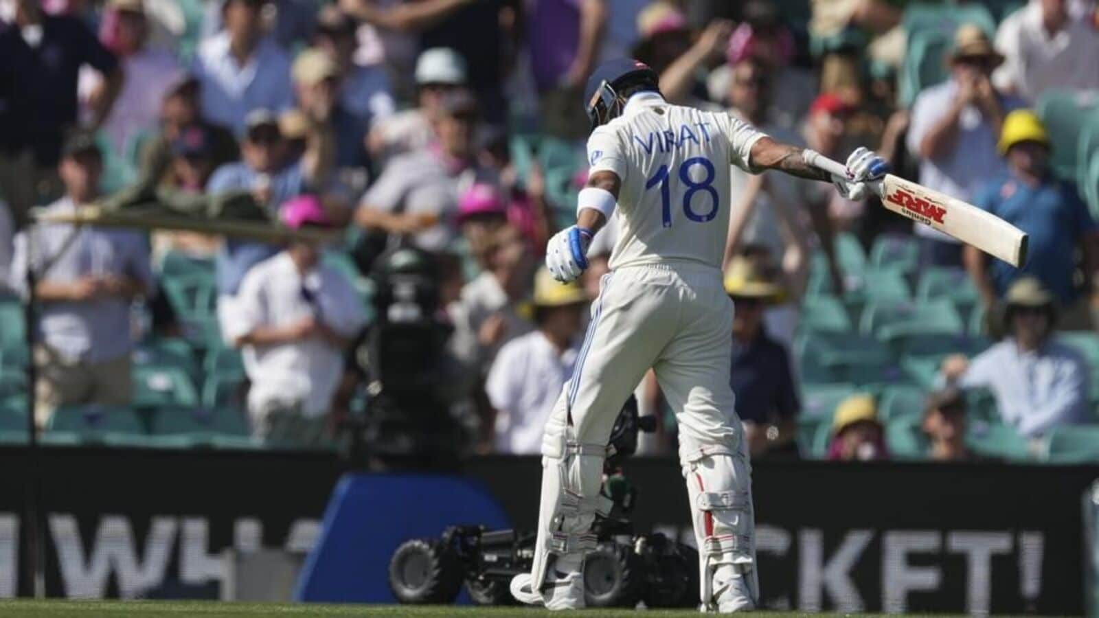 Virat Kohli walks back after being dismissed in the second innings of Sydney Test on Saturday. (AP)