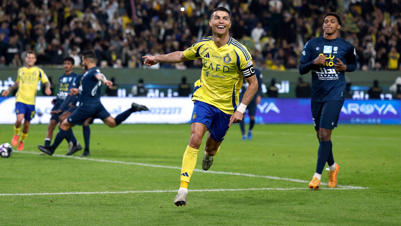 Al Nassr's Cristiano Ronaldo celebrates scoring their second goal against Al Okhdood in Saudi Pro League.