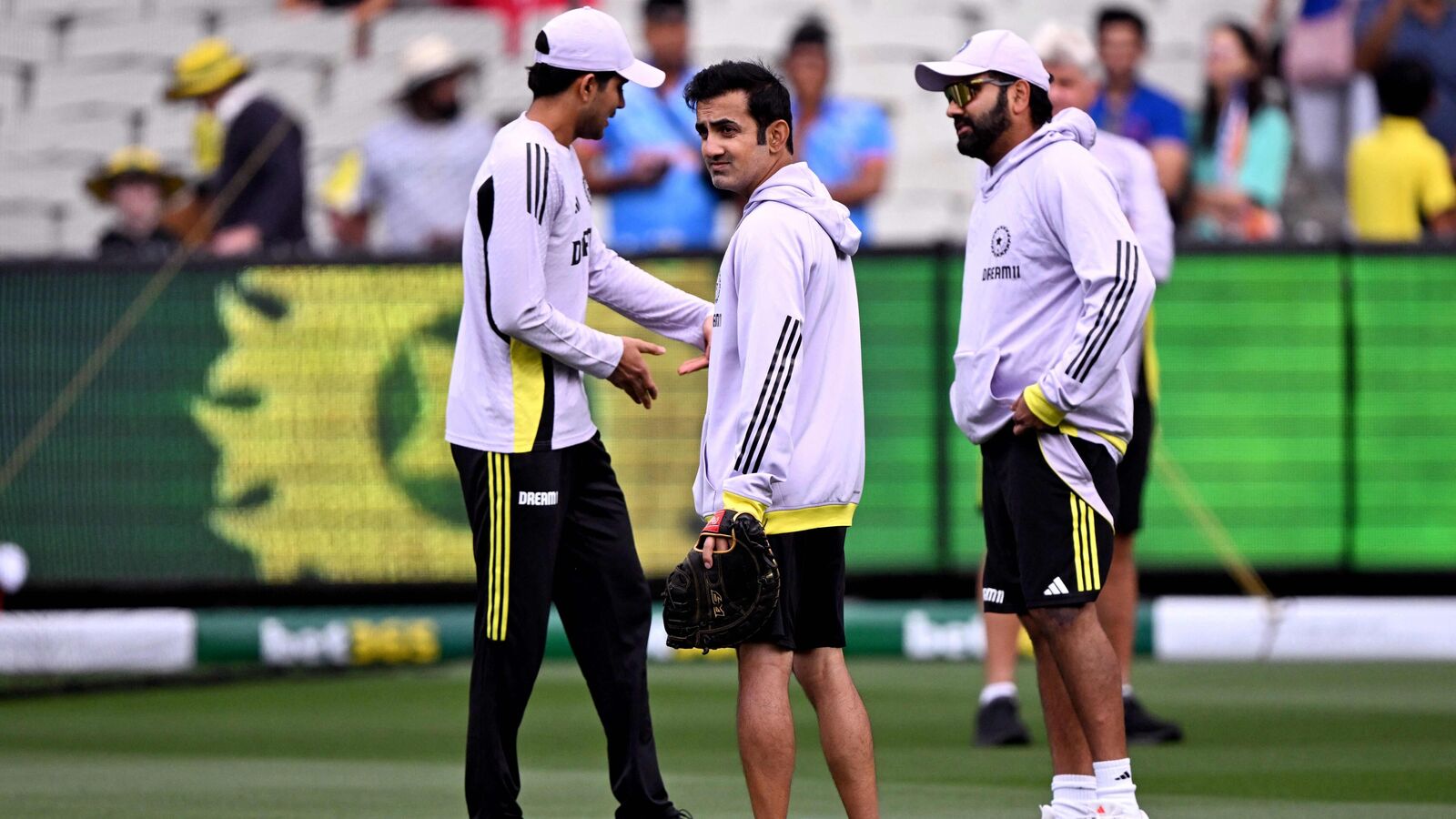 India's coach Gautam Gambhir (C) looks over the field before the start of the second day of the fourth cricket Test match between Australia and India at the Melbourne Cricket Ground (MCG) in Melbourne on December 27, 2024. (Photo by William WEST / AFP) 