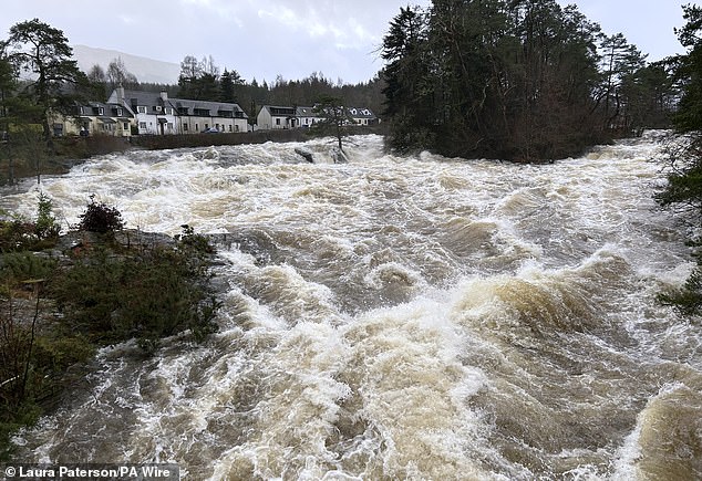 White water at the Falls of Dochart in Killin, Stirlingshire, today as stormy weather hits Scotland