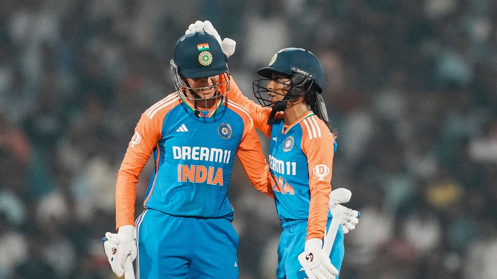 Navi Mumbai: India Women's Smriti Mandhana celebrates her half century with Jemimah Rodrigues during the third T20 International cricket match of a series between India Women and West Indies Women, at D Y Patil Sports Stadium, in Navi Mumbai, Thursday, Dec. 19, 2024.