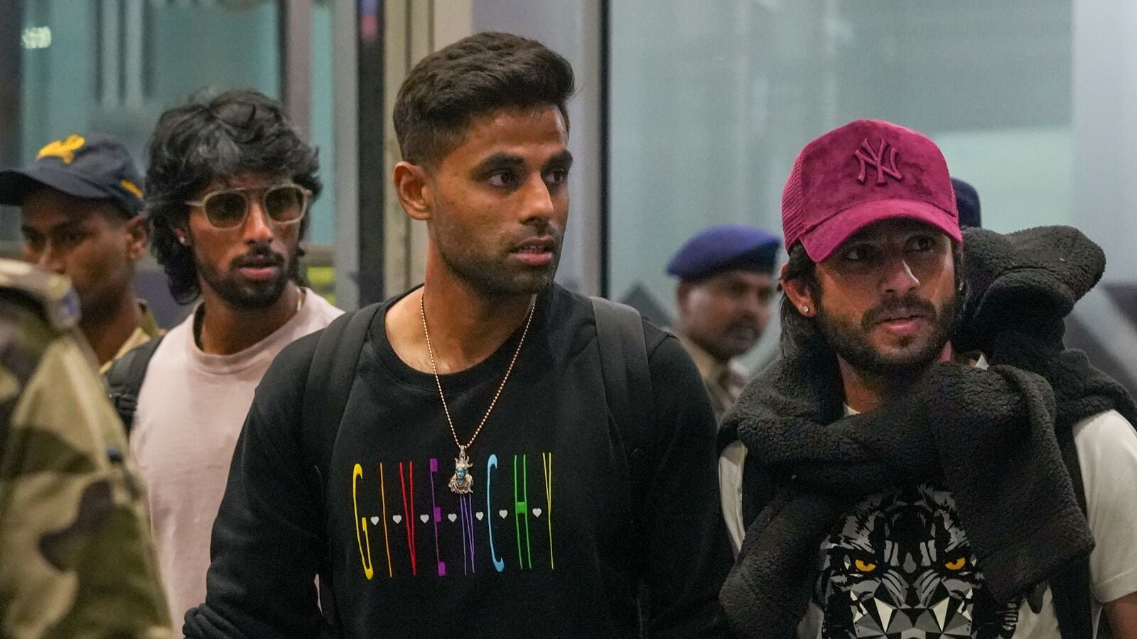 Kolkata: Suryakumar Yadav, center, Ravi Bishnoi, right, and Tilak Varma, back left, arrive at the airport ahead of the first T20I cricket match between India and England, in Kolkata, Saturday, Jan. 18, 2025. 