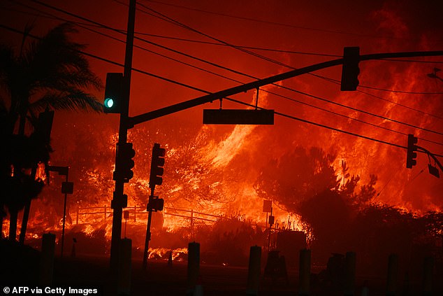 Flames overtake the intersection of Temescal Canyon and Pacific Coast Highway Fire at the Palisades Fire in Pacific Palisades