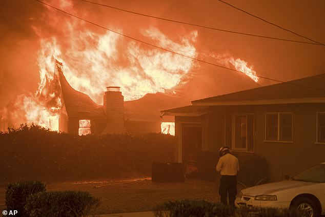 Pictured: A home burning in the Eaton Fire in Altadena, California amid the Los Angeles fires this month