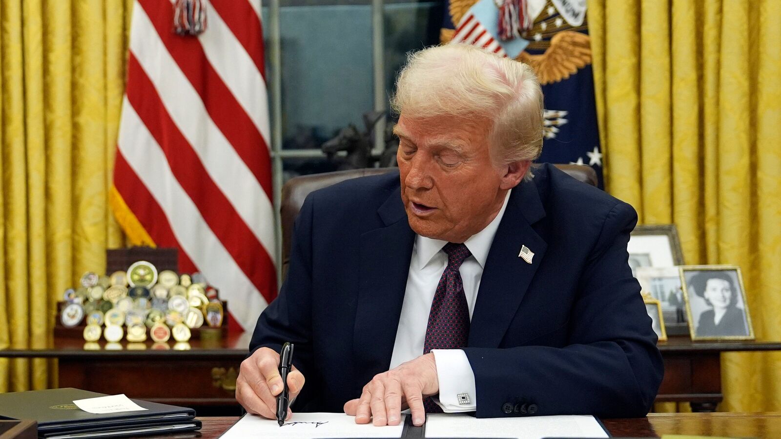 President Donald Trump signs an executive order on TikTok in the Oval Office of the White House, Monday, Jan. 20, 2025, in Washington. 