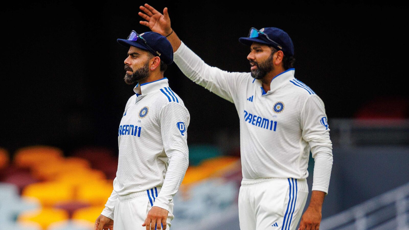 India's Rohit Sharma (R) gestures next to Virat Kohli in one of the Test matches against Australia in BGT 2024-25. 