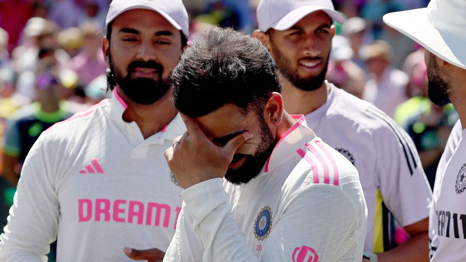 TOPSHOT - India�s Virat Kohli (2nd L) reacts with teammates during the trophy ceremony after the fifth cricket Test match between Australia and India at The SCG in Sydney on January 5, 2025. (Photo by DAVID GRAY / AFP) / -- IMAGE RESTRICTED TO EDITORIAL USE - STRICTLY NO COMMERCIAL USE --